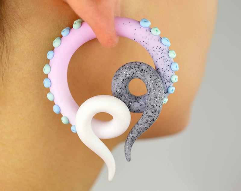 I made these pastel goth fake gauge tentacle earrings with glitter granite light pink white ombre and light green mint and light blue suction cups. This pair of earrings I make only as fake tentacle gauges (stud earrings, fake ear gauges).