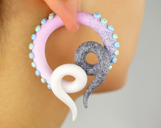 I made these pastel goth fake gauge tentacle earrings with glitter granite light pink white ombre and light green mint and light blue suction cups. This pair of earrings I make only as fake tentacle gauges (stud earrings, fake ear gauges).