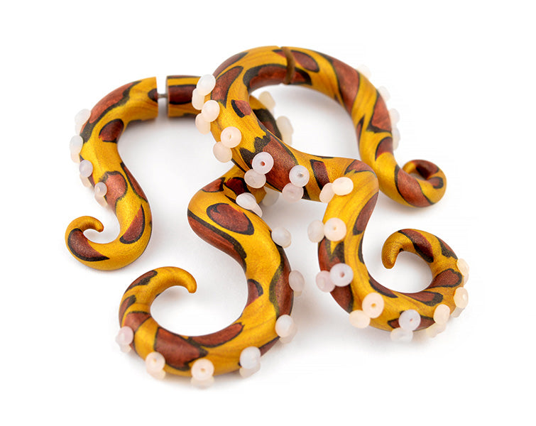 I made these animal print earrings of shimmer dust polymer clay. Leopard print clay earrings body include gold copper and black colors. Suction cups of leopard octopus tentacle gauges in translucent white. Leopard print earrings may suit those who are looking for leopard hoop earrings or leopard stud earrings or leopard leather earrings. Unique handmade leopard earrings by Tania Chernova. I make both fake gauge earrings and real ear gauges. Leopard gauges, leopard plugs, leopard tapers.