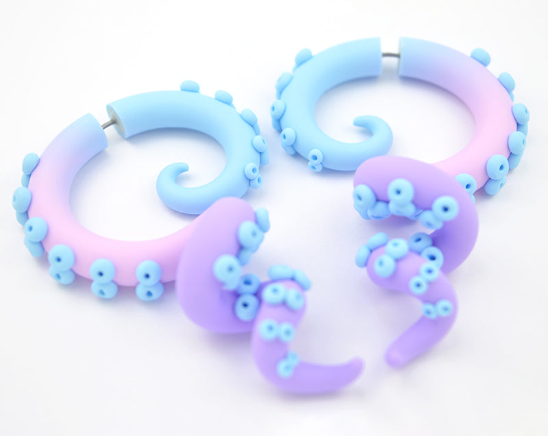 Cute kawaii pastel goth octopus tentacle earrings by Tania Chernova, Sweet Lolita fashion style. Unique earrings that look like octopus tentacles. Pastel earrings which give the impression of a stretched earlobe. Pastel gauges in 2g 1g 0g 00g 000g 7/16" 0000g for gauged earlobes. Kawaii pastel fashion, pastel goth aesthetic outfits. Pastel blue pastel pink pastel purple tentacle earrings. Light blue light pink light purple octopus earrings.