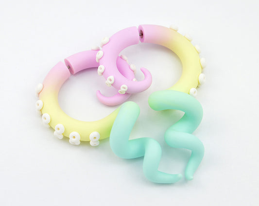 Pastel rainbow aesthetic earrings yami kawaii pastel goth tentacle earrings, rainbow earrings with pastel colors. Light pink, vanilla or light yellow, mint or light green aesthetic tentacle earrings with white suction cups. Kpop fairy kei fake gauge earrings.