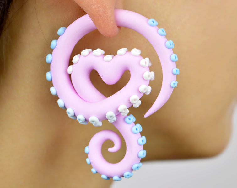 I made these pastel goth tentacle earrings with light pink body and light blue white suction cups, yami kawaii Sweet Lolita earrings by Tania Chernova, fairy kei fashion. I make both types of octopus earrings faux fake gauge earrings (stud earrings) and real ear gauges (for gauged earlobes). Creepy cute kpop menhera kei tentacle gauges.