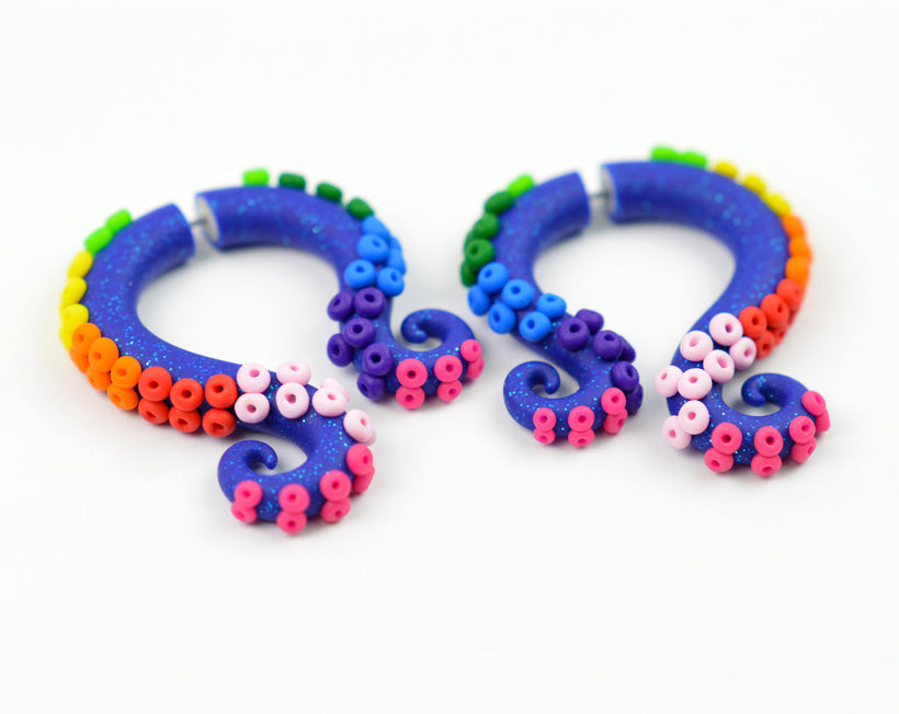 Rainbow brite and the star stealer inspired tentacle earrings octopus gauges by Tania Chernova. Glitter blue octopus tentacles with rainbow suckers stud earrings and ear gauges. Fake gauge earrings for only pierced earlobes and real ear plugs for gauged stretched earlobes. Handmade body jewelry. Nice with rainbow brite halloween costume for rainbow brite cosplay, rainbow brite dress rainbow brite costume womens rainbow brite costume.