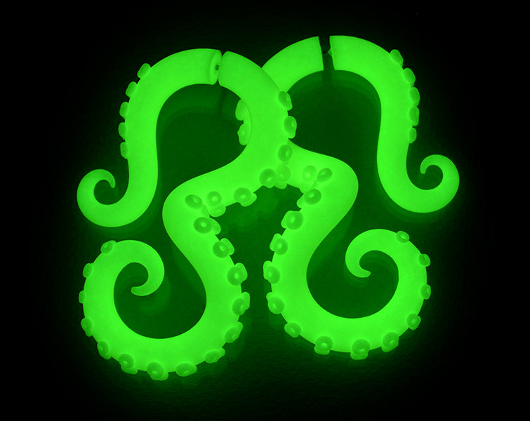 Unique glow in the dark earrings, artisan octopus tentacle earrings and ear gauges by Tania Chernova. Glow kraken sea monster earrings, nautical kraken monster tentacle fake gauge earrings. Pastel Sweet Lolita fashion style color fake tentacle gauges. Pastel goth aesthetic earrings. Green glow earrings fake tapers.