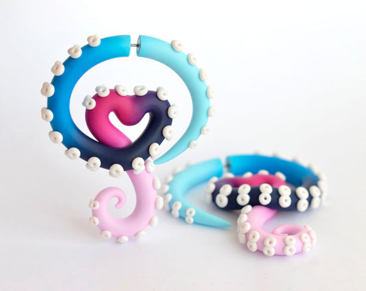 I made these omnisexual earrings with heart and in omni sexual pride flag colors. Omni earrings in octopus tentacles shape and light pink, pink, navy blue, blue and light blue colors.