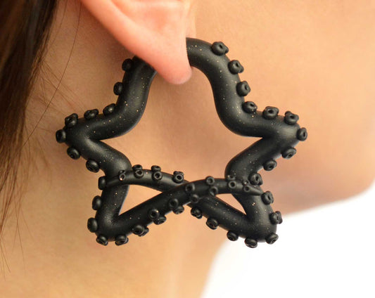 Large star stud earrings hoops — octopus tentacle earrings from Tania Chernova. Star octopus fake gauge earrings or faux plugs. Customizable star earrings, you can customize color for the body of the tentacles and color for the suckers. Black stars with glitter.
