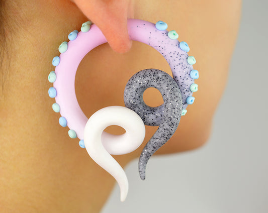I made these pastel goth fake gauge tentacle earrings with glitter granite light pink white ombre and light green mint and light blue suction cups. This pair of earrings I make only as fake tentacle gauges (stud earrings, fake ear gauges). 
