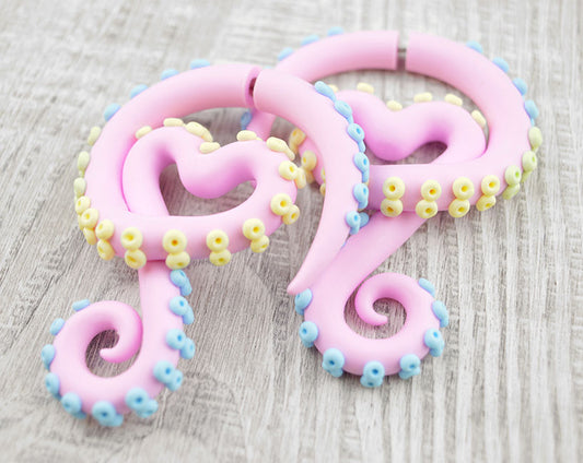 Octopus tentacle earrings with pastel pink tentacle body and pastel blue pastel yellow suction cups. This is a very beautiful color combination that will definitely please the pastel goths, yami kawaii goths and also to fans fairy kei fashion and Sweet Lolita outfit and soft pastel grunge.