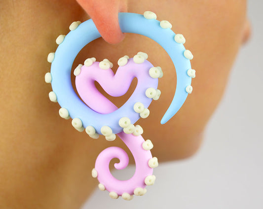 I made these kawaii tentacle earrings with light pink pastel blue ombre body and glow in the dark dots suction cups. Unique handmade octopus earrings by Tania Chernova. Body jewelry tentacle gauges octopus gauges and fake gauge earrings. Creepy cute earrings, pastel goth yami kawaii menhera kei fairy kei kpop fashion.