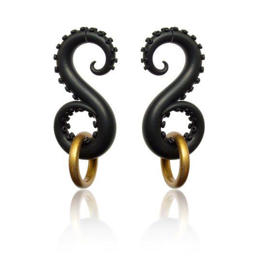 Tentacle earrings, octopus keeps ring, fake tentacle ear gauges by Tania Chernova. Octopus earrings with black tentacles and suction cups that have found treasures on the seabed and holds a golden ring with its tentacle.