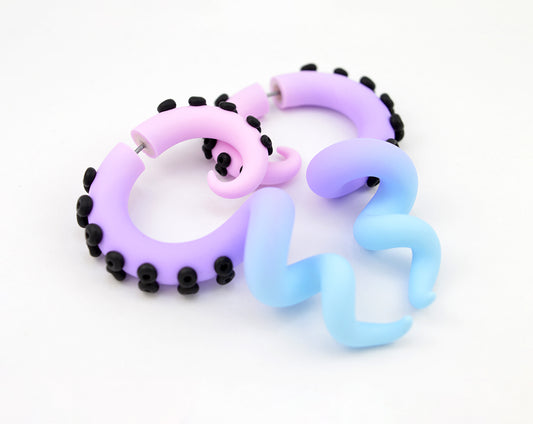 Black pastel goth tentacle earrings by Tania Chernova, light pink light purple light blue kpop yami kawaii fairy kei earrings with black suction cups.