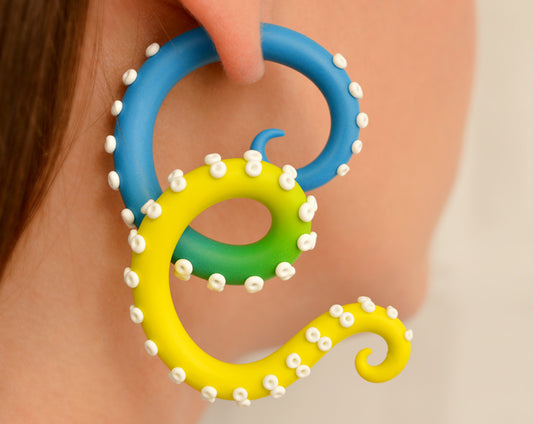 Blue and yellow ombre octopus tentacle earrings, Ukraine flag earrings, fake gauge earrings and ear gauges, fake body jewelry by Tania Chernova. Fake taper earrings.