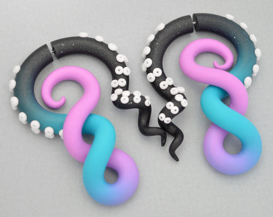 I made these double helix earrings with glitter black turquoise lilac ombre. I made these octopus tentacle earrings in both real ear gauges and fake ear gauges. Handmade tentacle gauges by Tania Chernova. Ear plugs and fake tapers that look like octopus tentacles.