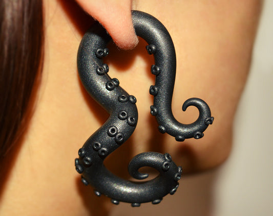 I made these octopus tentacle earrings, tentacle gauges in solid shimmer black. Unique handmade alternative earrings by Tania Chernova. Fake gauge earrings and real ear gauges. These octopus earrings in general will look good with any black clothes and black outfit even with black womens pants suit and black puffer jacket. In any case, my gauge earrings will not leave you without attention of others.