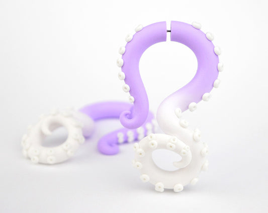 I made these tentacle earrings with light purple and white ombre. Yami kawaii earrings, tentacle gauges and tentacle stud earrings / fake gauge earrings. Lilac lavender pastel goth earrings octopus gauges taper earrings. Handcrafted fake tentacle ear gauges by Tania Chernova. Sweet Lolita fairy kei fashion accessories.