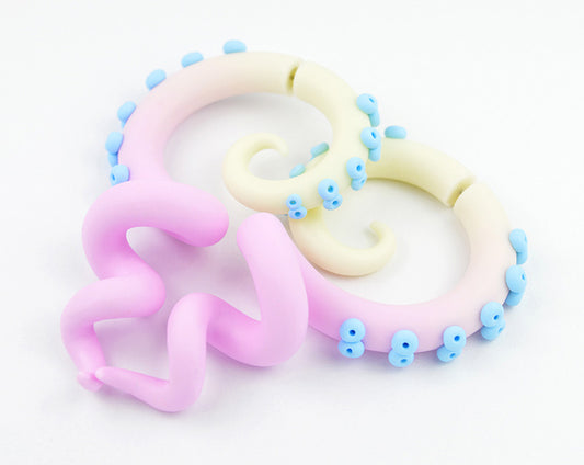 I made these tentacle earrings with ombre from glowing light yellow to light pink and with light blue suction cup dots. Fake gauge earrings / fake gauges and ear gauges for gauged earlobes.