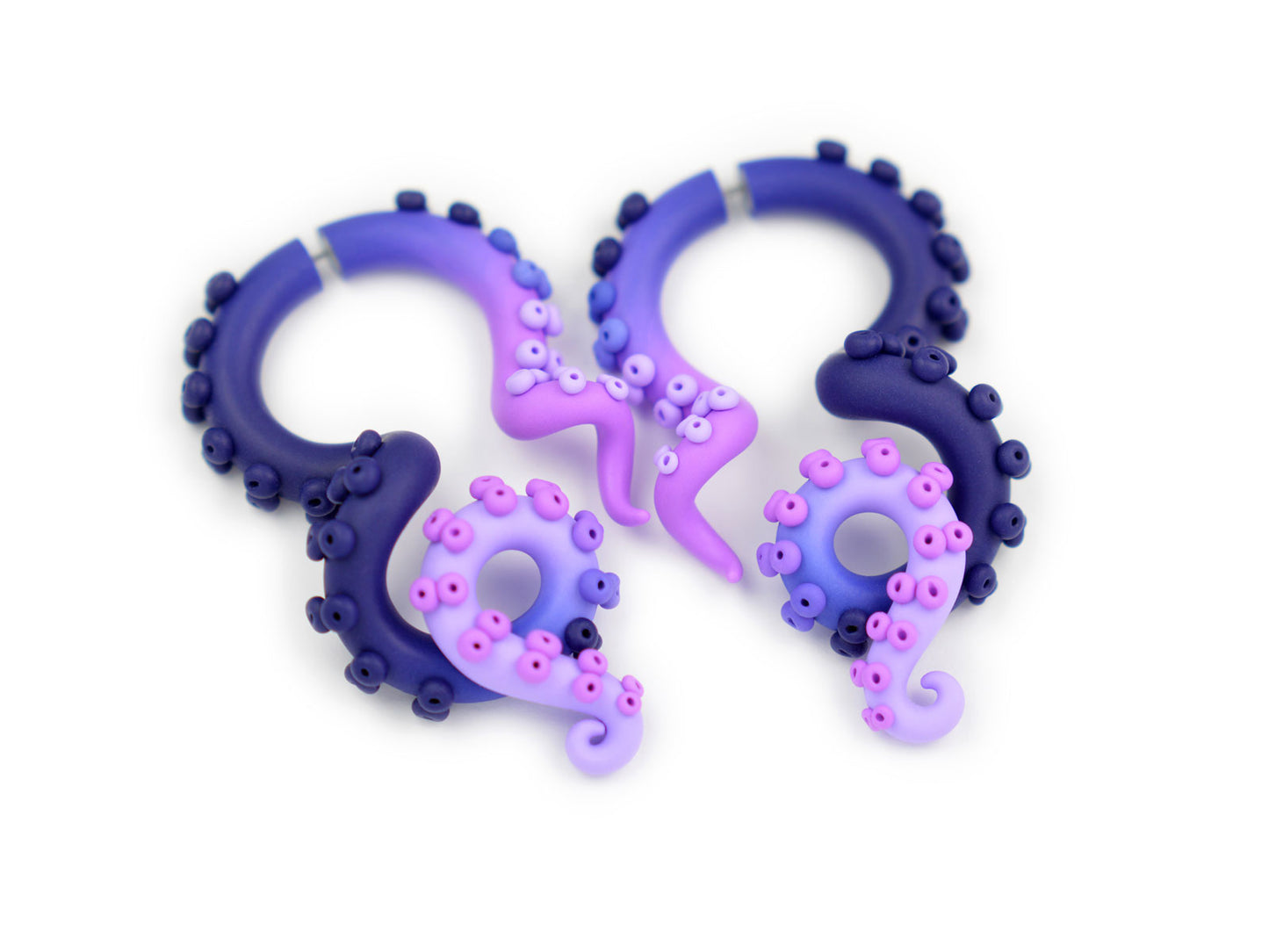 Unique artisan octopus tentacle earrings by Tania Chernova, fake ear gauges.