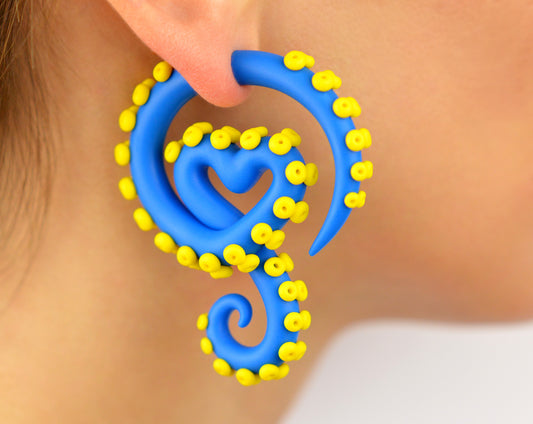 Blue octopus tentacle earrings with yellow suction cups, unique fake ear gauges by Tania Chernova