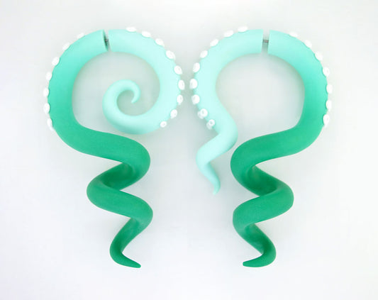 I made these fake tentacle gauges as asymmetrical hoop earrings or asymmetrical spiral earrings with mint green ombre and white dots.