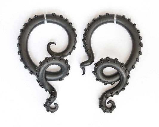 I made these tentacle hoop earrings as asymmetrical earrings. Octopus earrings in solid black so they can safely be called gothic earrings. Asymmetric goth earrings I can make as fake gauge earrings and as ear gauges. Asymmetrical hoop earrings that look like octopus tentacles.
