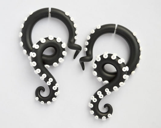I made these octopus earrings in black and white. Stud tentacle earrings for men and stud earrings for women, fake ear gauges and real ear gauges. Unisex earrings are cool with black and white dress or black and white converse, black and white striped pants or any black and white outfit. Handmade black and white tentacle earrings by Tania Chernova.