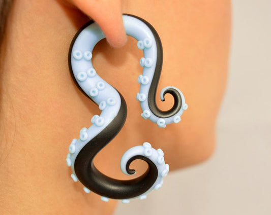 I made these fake gauge tentacle earrings with blue in black colors. Blue and black octopus ear gauges / ear plugs. Black with blue octopus earrings. Handmade body jewelry by Tania Chernova. Black pastel goth faux gauges / faux plugs and true ear plugs.