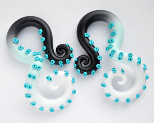 I made these yami kawaii tentacle earrings with black mint white ombre for tentacle body and turquoise suction cups.