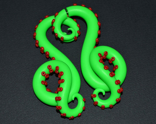 I made these octopus tentacle earrings with green and red colors since i was inspired by zombie movies and I wanted to make something like zombie octopus. Zombie tentacle earrings can be made both zombie ear gauges for stretched earlobes and zombie fake gauges like stud earrings. Halloween earrings by Tania Chernova.