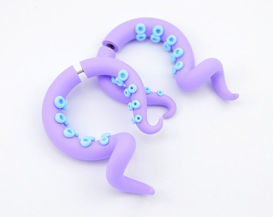 Tentacle earrings with light purple body and light blue suction cups.