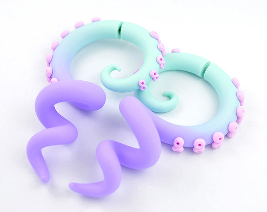 I made these tentacle gauges with mint green to light purple ombre and light pink suction cups. I make tentacle earrings as true ear gauges and fake gauge earrings that look like gauges. Octopus plugs handmade by Tania Chernova.