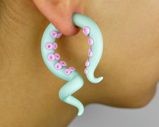 Mint or light green body and light pink suction cups. I make these tentacle earrings in both, tentacle gauges and fake gauge earrings.