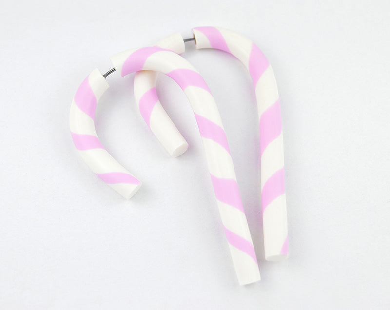 I made these christmas candy cane earrings with light pink and white stripes, handmade pastel kawaii christmas earrings by Tania Chernova. Red and white yami kawaii earrings.