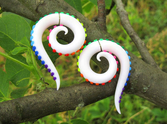 I made these octopus tentacle earrings in white with rainbow dots.