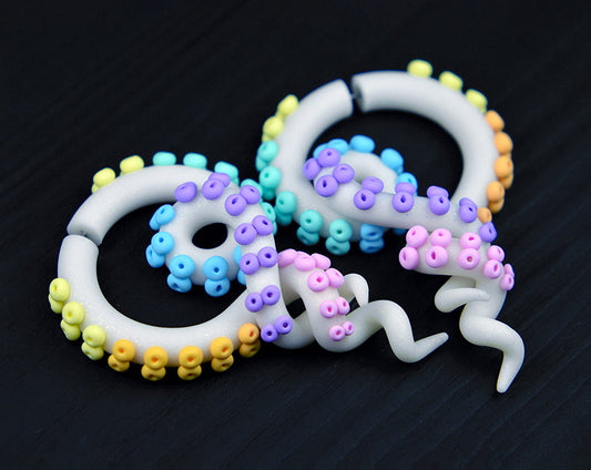 Rainbow goth aesthetic or kawaii earrings in glitter white with pastel rainbow dots / suction cups.