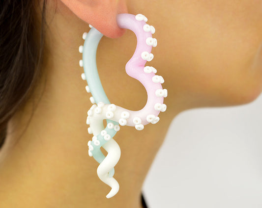 I created these octopus tentacle earrings with heart and glitter white rose quartz ice quartz ombre. This is not real rose quartz crystal and blue ice quartz but just polymer clay however looks pretty good. You can change colors. Handmade heart earrings / heart gauges by Tania Chernova. Fake plugs and real ear gauges.