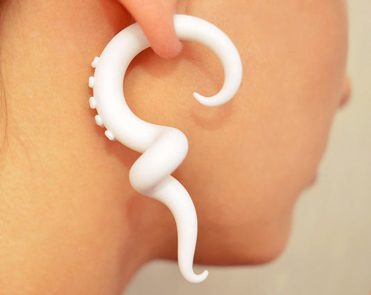 I made these earrings that look like gauges in pure white. I can make these tentacle earrings as fake gauges and as real tentacle gauges.